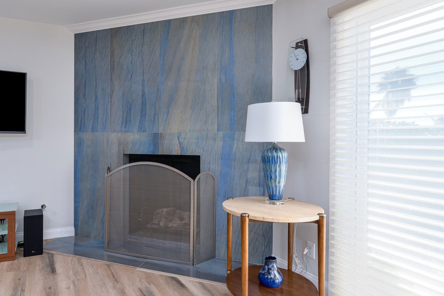 image shows Porcelain Tile Fireplace in Shades of Blue & Taupe, West Hills, CA Home Remodel 