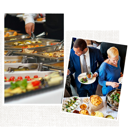 A man and a woman are standing at a buffet table eating food.