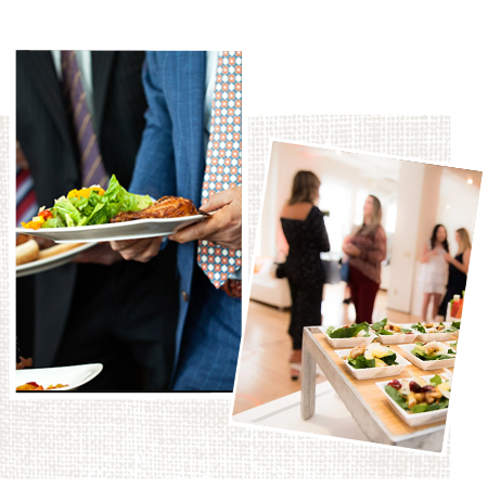 A man in a suit and tie is holding a plate of food