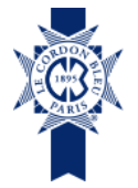 The logo for le cordon bleu paris is a blue ribbon with a cross on it.