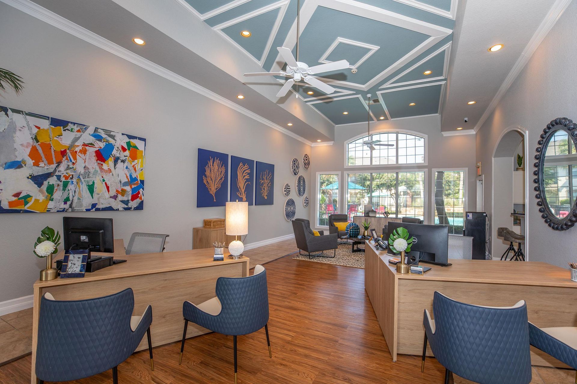 A large room with a lot of furniture and a ceiling fan at Windsor Estates.