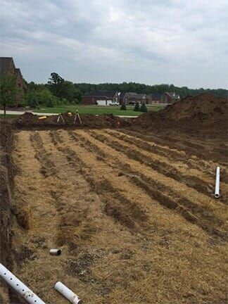 Excavation In Progress — Imlay City, MI — All American Septic Service