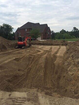Dirt Field Being Excavated — Imlay City, MI — All American Septic Service