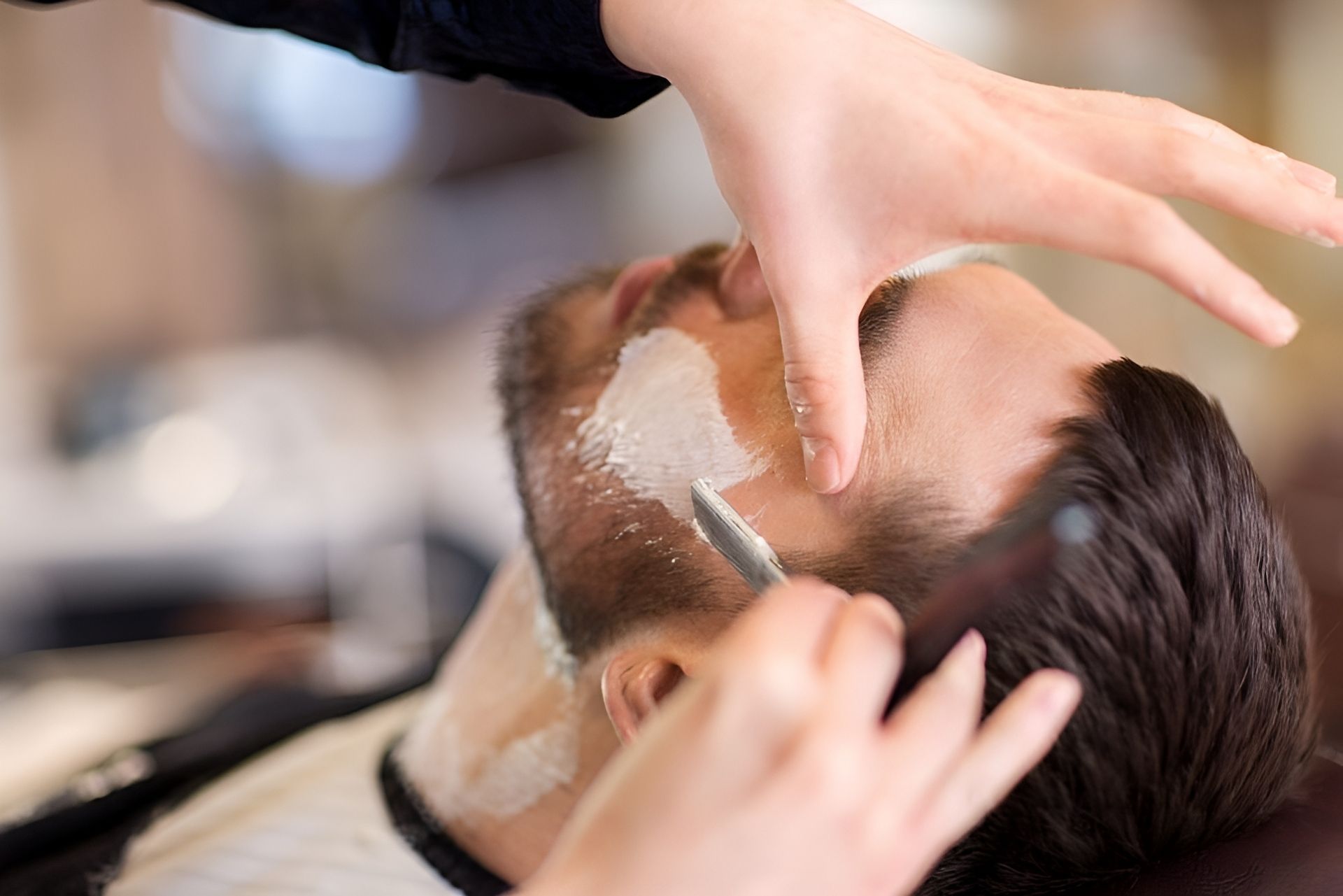 A Man With Facial Hair is Getting a Trim at the Barber Shop — Hair Obsession Barber in Nightcliff, NT