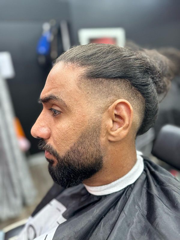 A Barbershop Scene Where a Bearded Man is Getting a Fresh Cut — Hair Obsession Barber in Nightcliff, NT