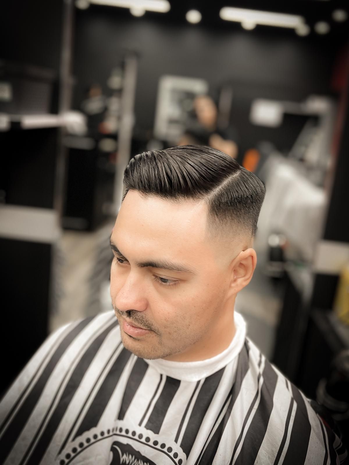 A Man With Trendy Hair Is Having His Haircut at a Barbershop — Hair Obsession Barber in Nightcliff, NT