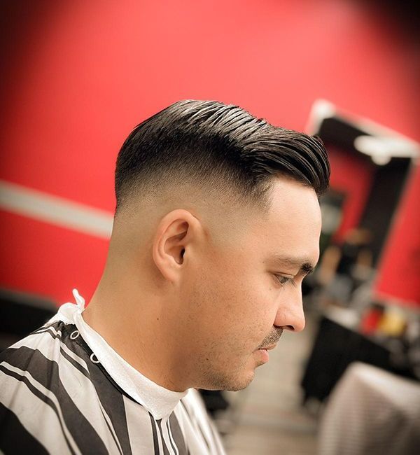 A Man With Hair Gel is Getting His Hair Cut at a Barber Shop — Hair Obsession Barber in Nightcliff, NT