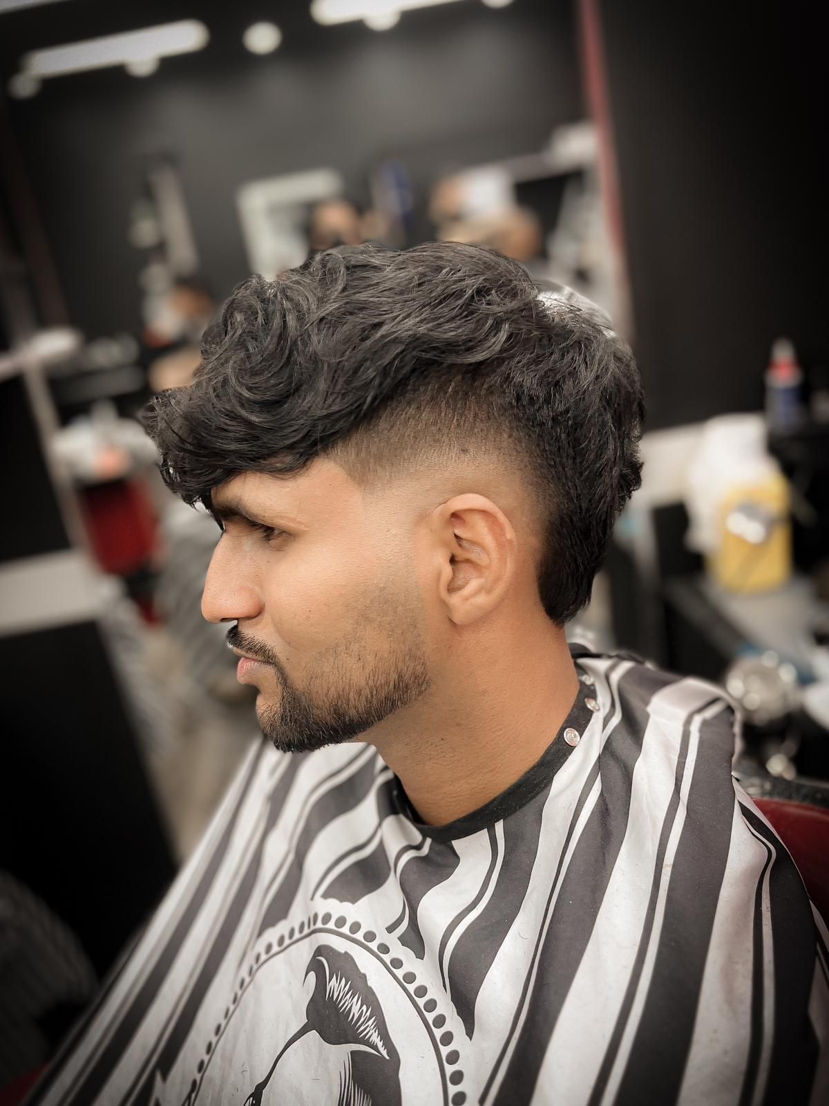 A Fashion-Forward Man Is Getting His Hair Cut at a Barber Shop — Hair Obsession Barber in Nightcliff, NT
