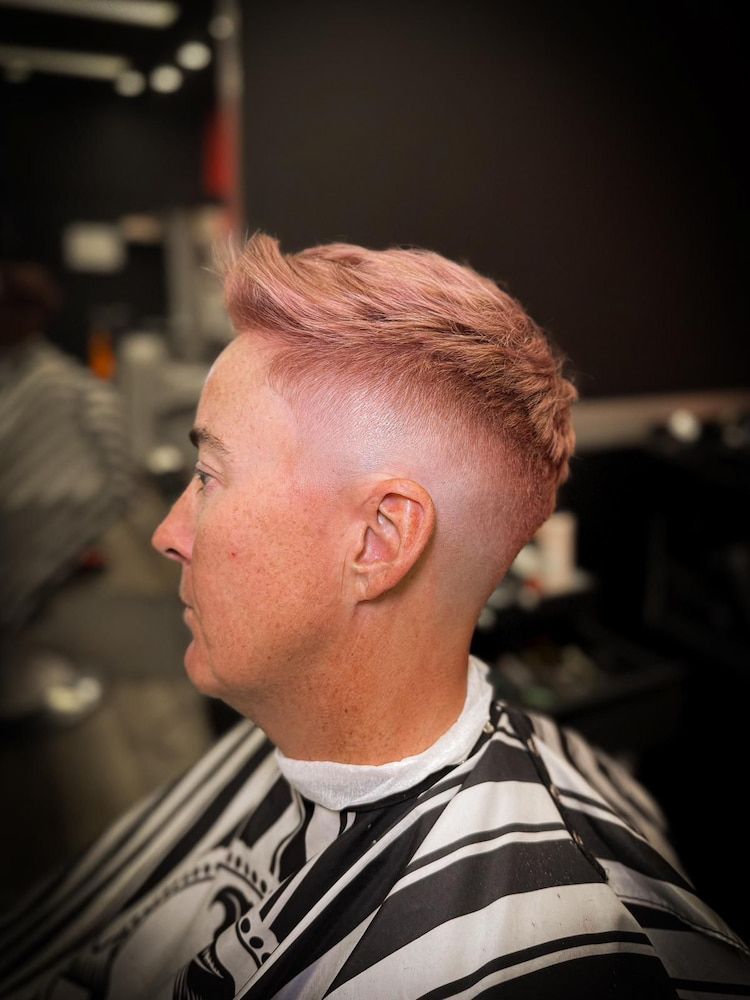 A Man With a Pink Coloured Hair is Getting His Hair Cut — Hair Obsession Barber in Nightcliff, NT