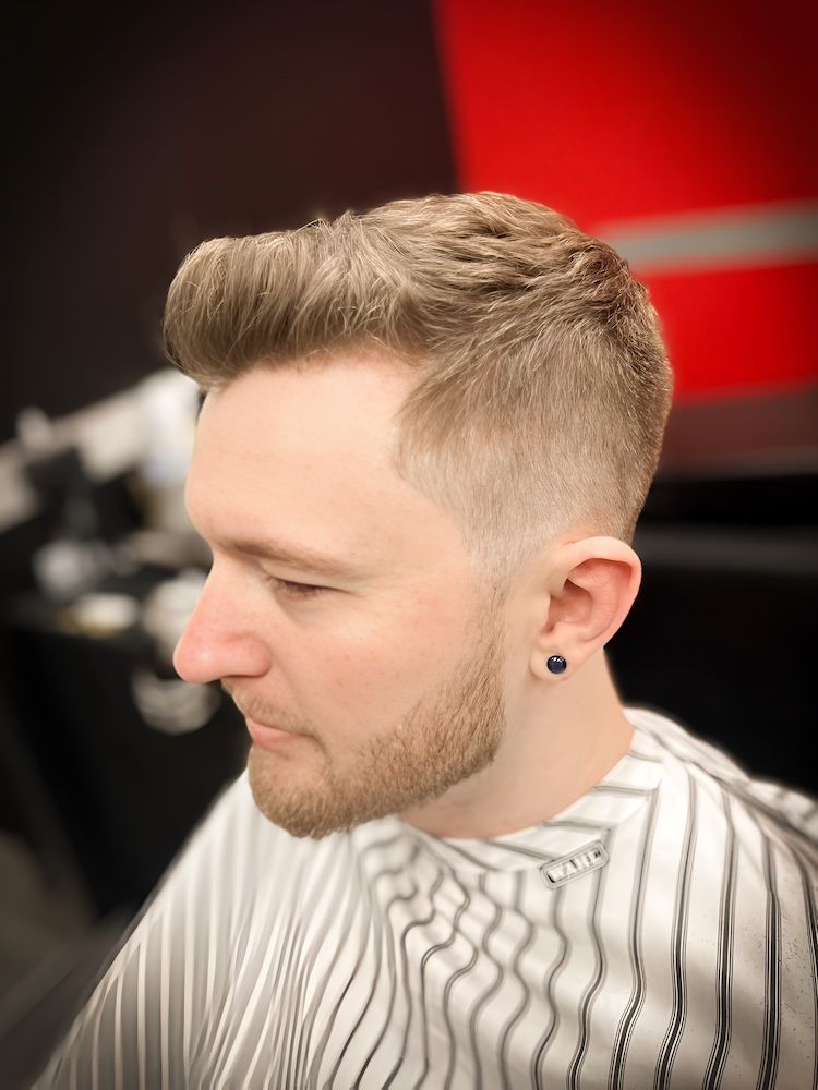 A Man Wearing a Mask is Shaving Another Man 's Face With a Razor — Hair Obsession Barber in Nightcliff, NT