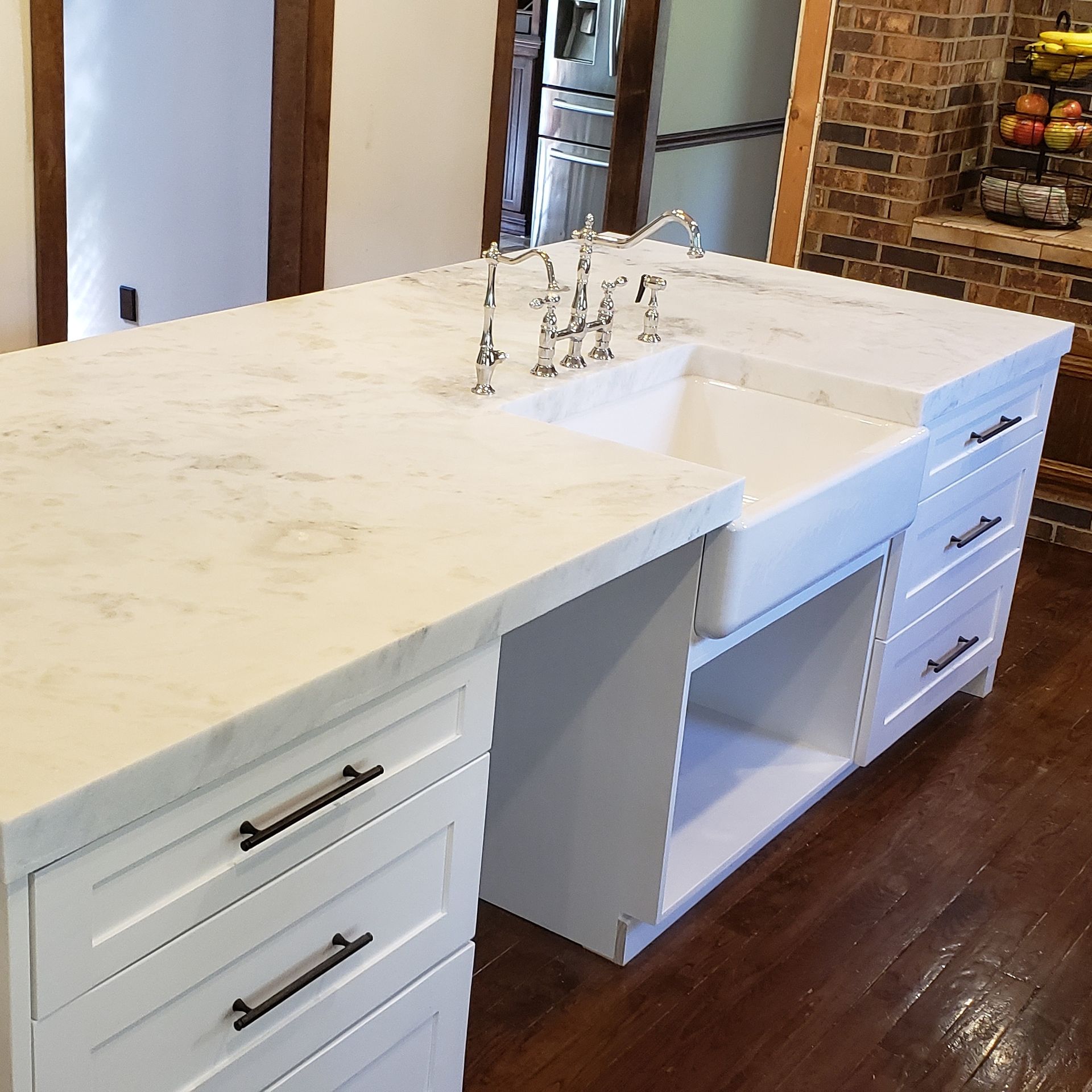 A kitchen with a large island and a sink