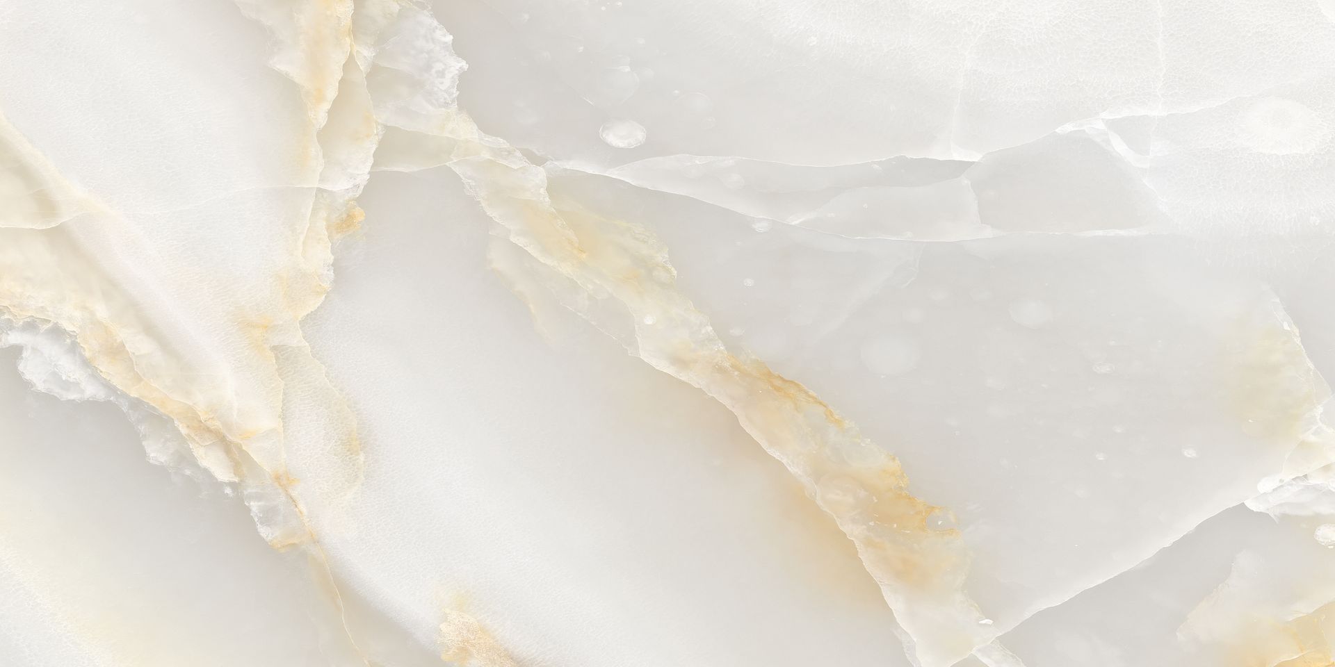 A close up of a white and gold marble texture.