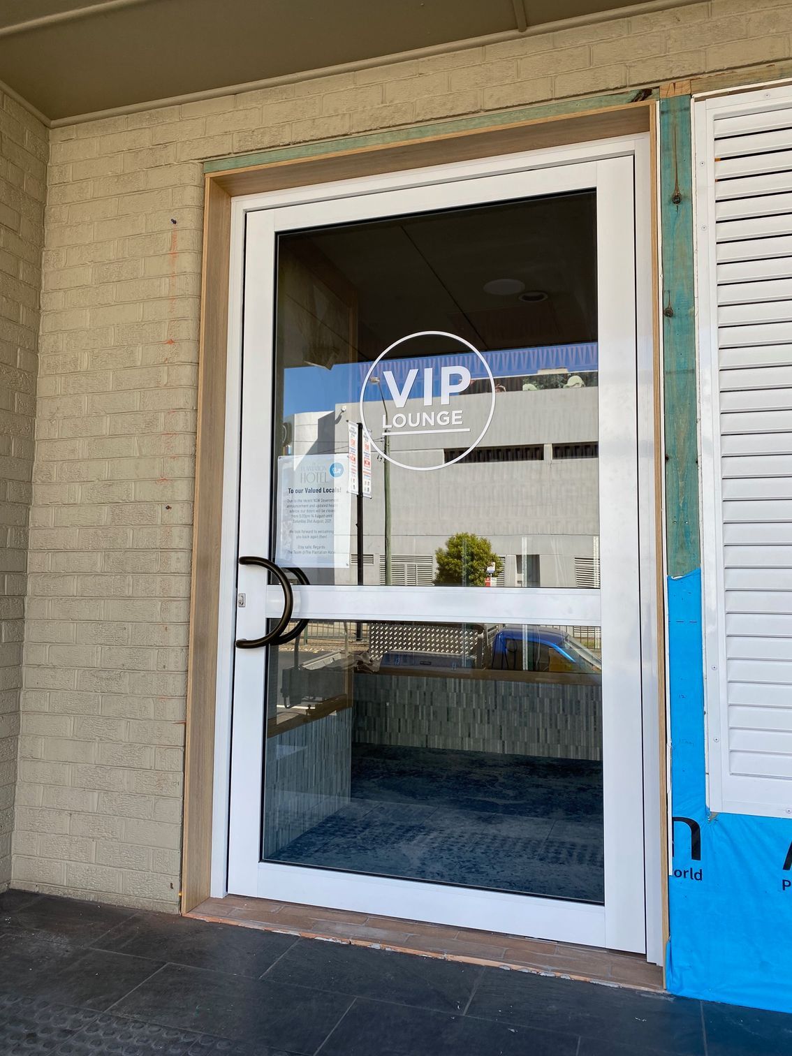 A White Door With the Word VIP on It — Rooney Glass in Coffs Harbour, NSW