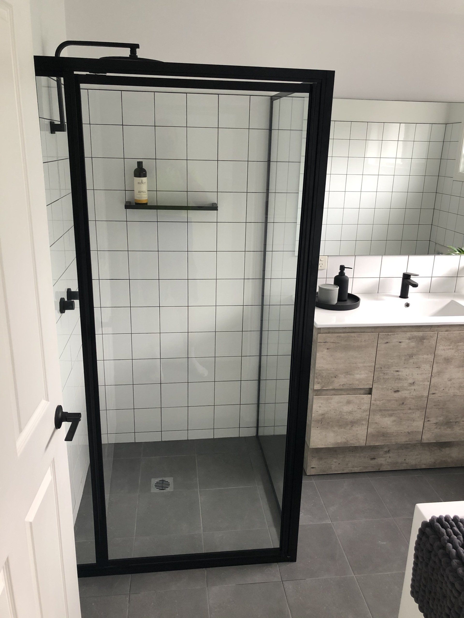 A Bathroom With a Walk in Shower and a Sink — Rooney Glass in Coffs Harbour, NSW
