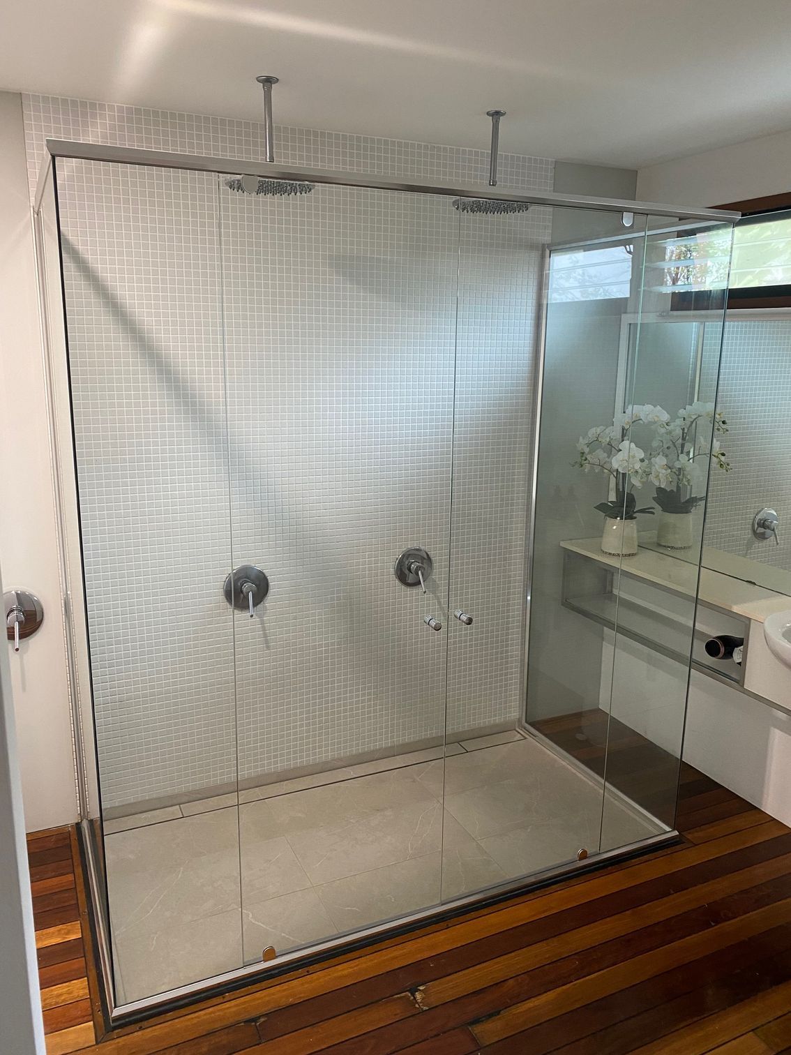 A Bathroom With a Walk in Shower and a Sink — Rooney Glass in Coffs Harbour, NSW