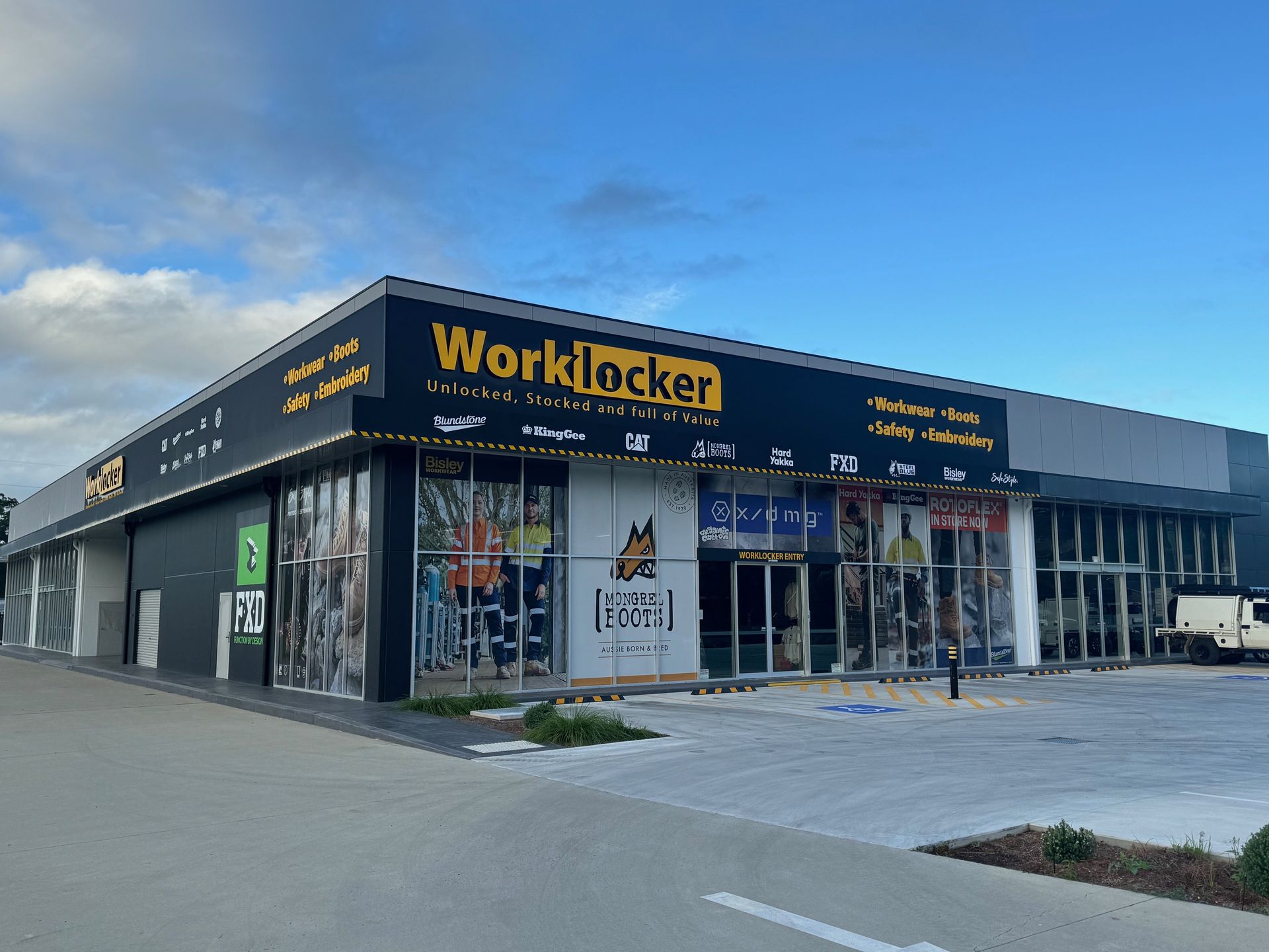 A Large Building With a Sign That Says Worklocker on It — Rooney Glass in Coffs Harbour, NSW