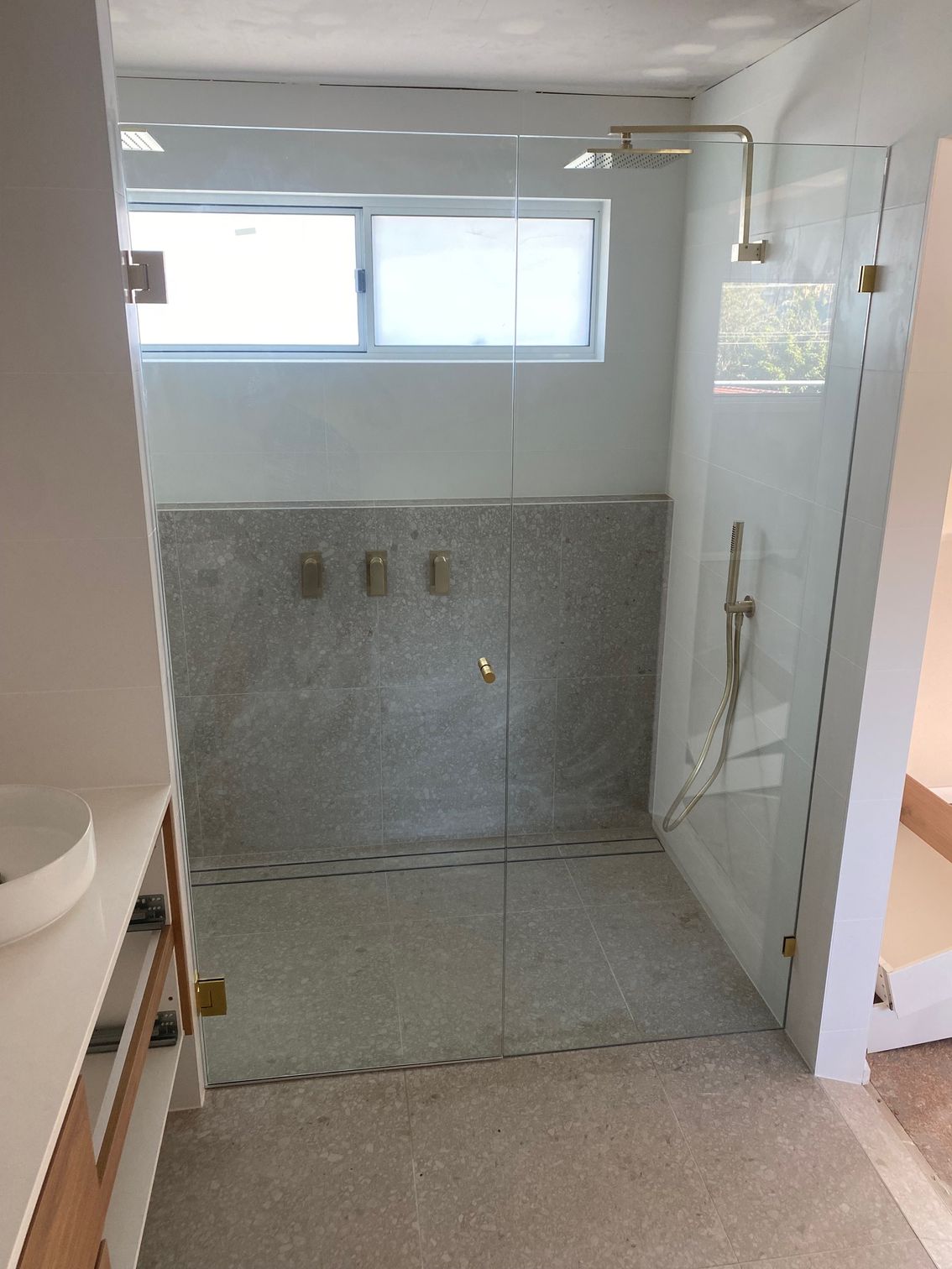 A Bathroom With a Walk in Shower and a Window — Rooney Glass in Coffs Harbour, NSW