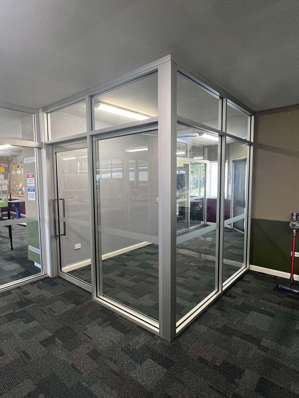 Room With A Lot Of Windows And A Carpeted Floor — Rooney Glass in Coffs Harbour, NSW