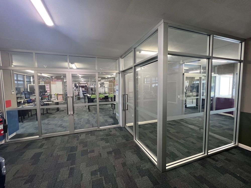A Large Room With A Lot Of Windows And A Fire Extinguisher — Rooney Glass in Coffs Harbour, NSW