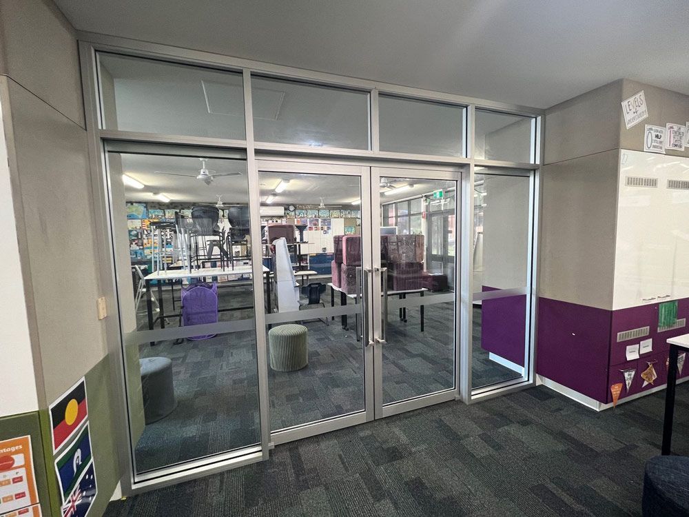 Room With A Lot Of Glass Doors And A Purple Wall — Rooney Glass in Coffs Harbour, NSW
