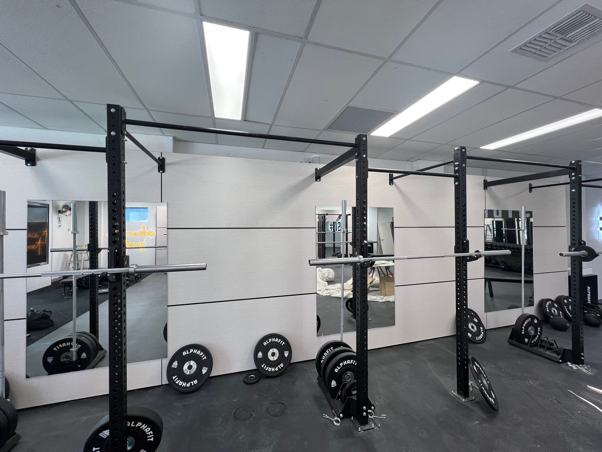 A Gym With a Lot of Weights and Mirrors — Rooney Glass in Coffs Harbour, NSW