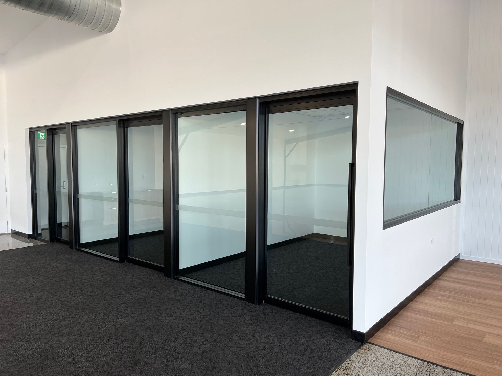 A Room With a Lot of Glass Doors and Windows — Rooney Glass in Coffs Harbour, NSW