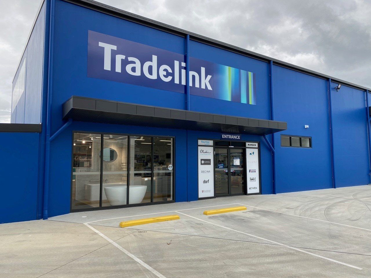 A Blue Building With the Word Tradelink on It — Rooney Glass in Coffs Harbour, NSW