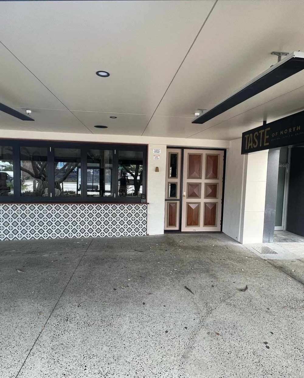 A Building With a Lot of Windows and a Door — Rooney Glass in Sawtell, NSW