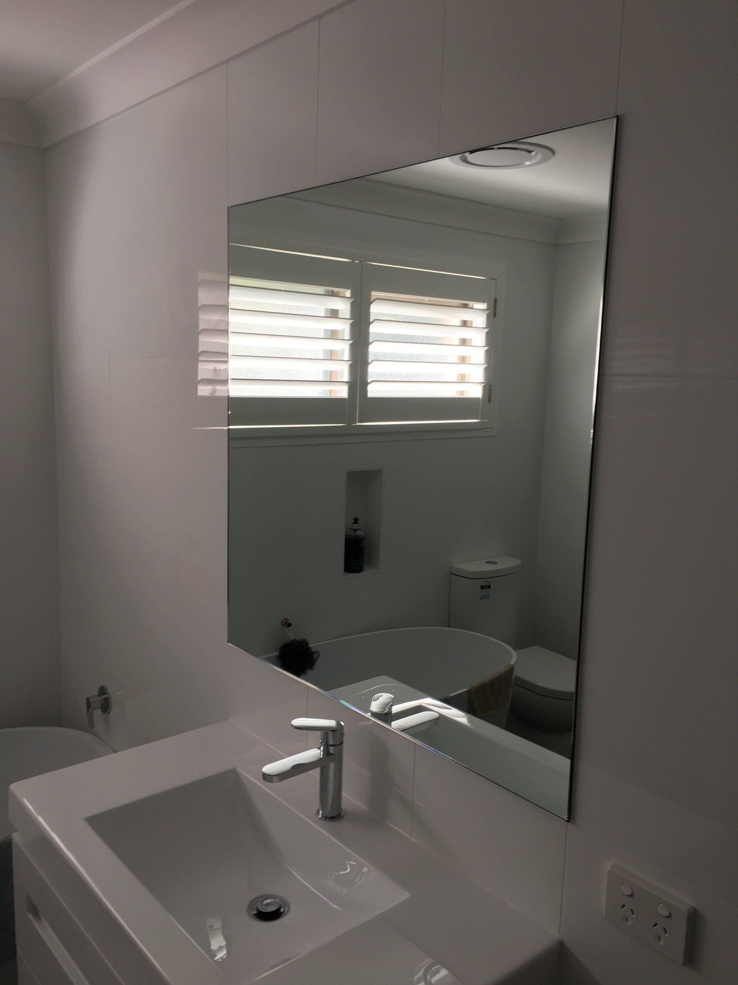 Mirror On The Bathroom Wall — Window Glass Repair and Installation in Coffs Harbour, NSW