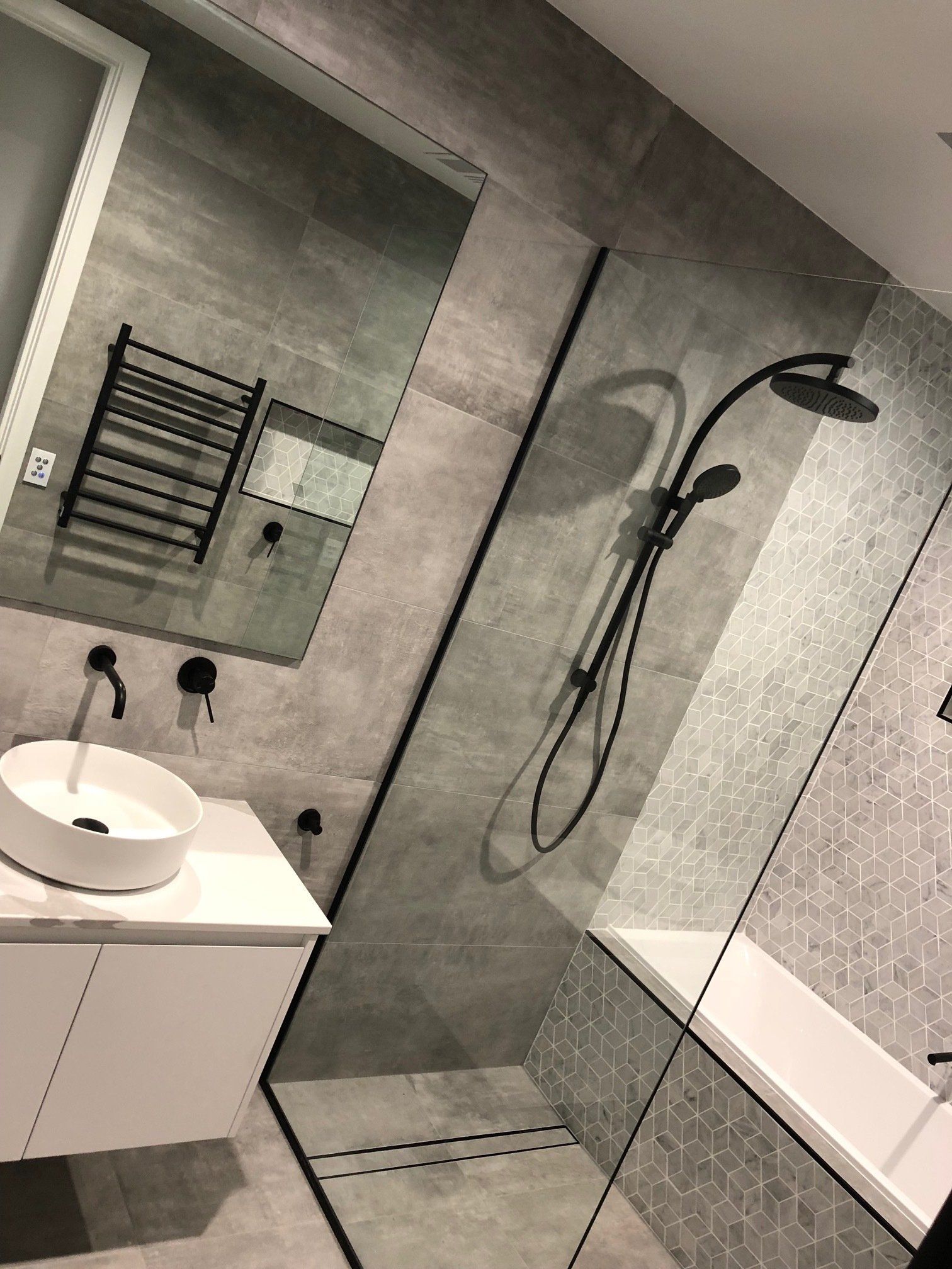 A Bathroom With a Sink, Shower, and Mirror — Rooney Glass in Coffs Harbour, NSW
