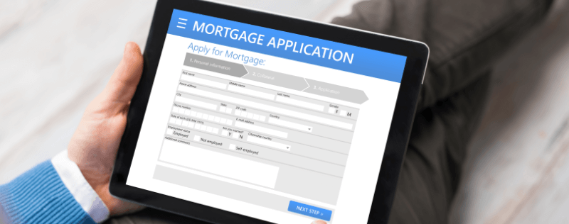 Person holding a tablet displaying a mortgage application.