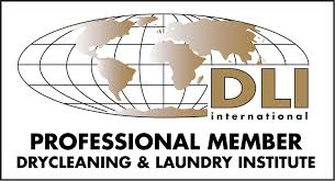 A logo for a professional member of the drycleaning and laundry institute.