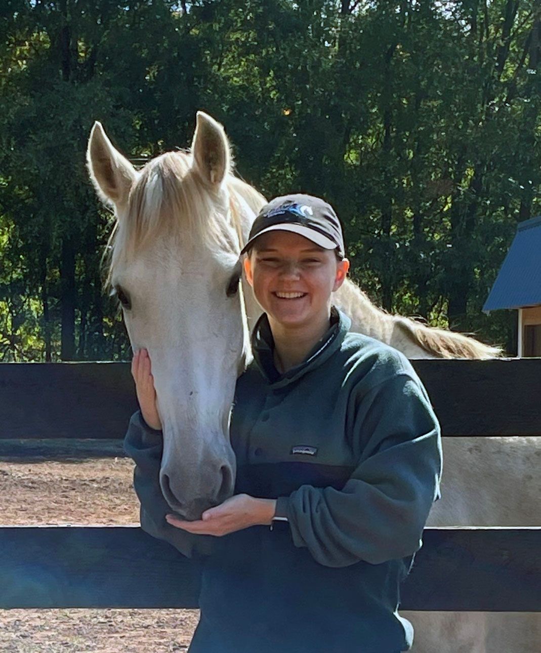 photo of Lenux Stables instructor Stephanie Bush with American Saddlebred horse and dog