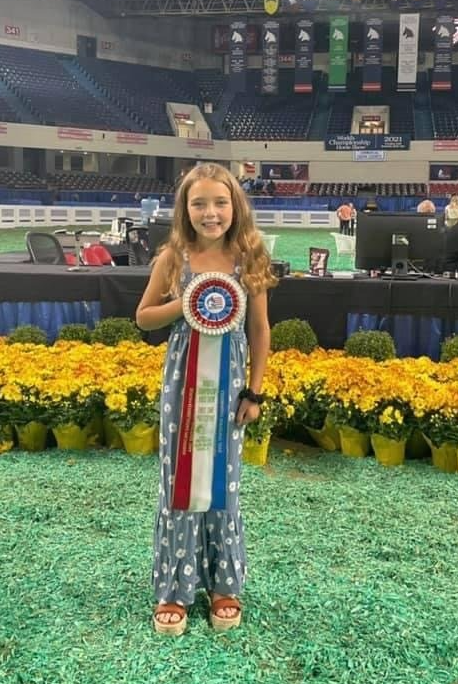 photo of young girl displaying her World's Championship Horse Show 
