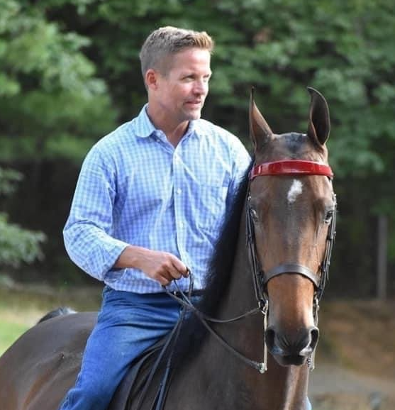 photo of Lenux Stables owner and trainer Quintus VanderSpuy on American Saddlebred horse