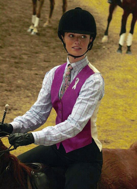 photo of Lenux Stables rider sitting on horse in horse show competition