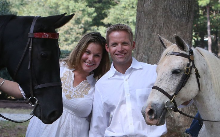 photo of Lenux Stables owners and trainers Brooke and Quintus VanderSpuy each holding horse