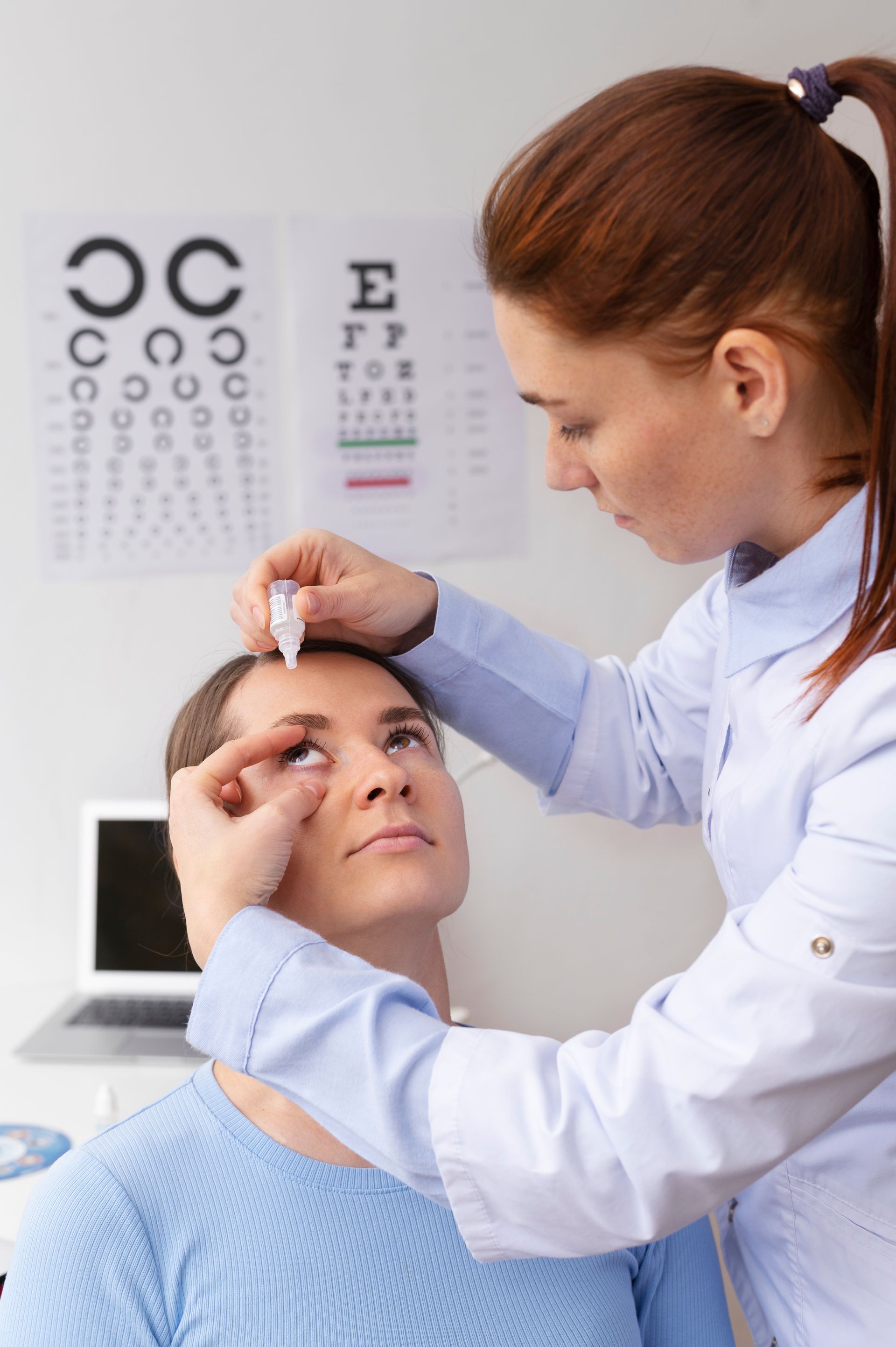 A woman is getting her eyes examined by an ophthalmologist.