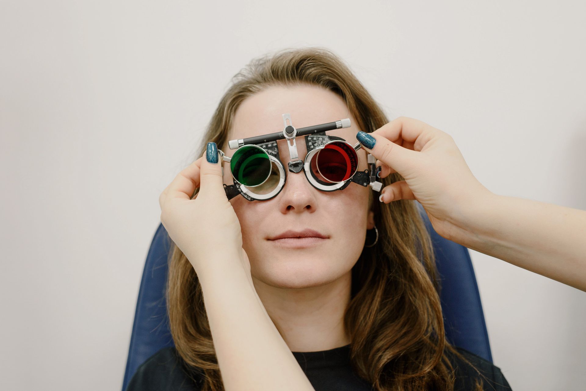 A woman is getting her eyes checked by an ophthalmologist.