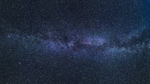 The milky way galaxy is visible in the night sky.