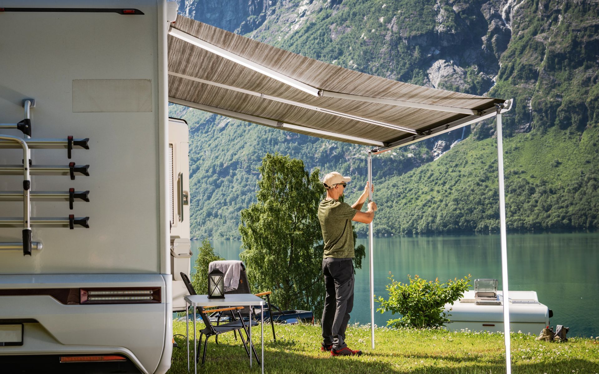 A man is standing under an awning next to a