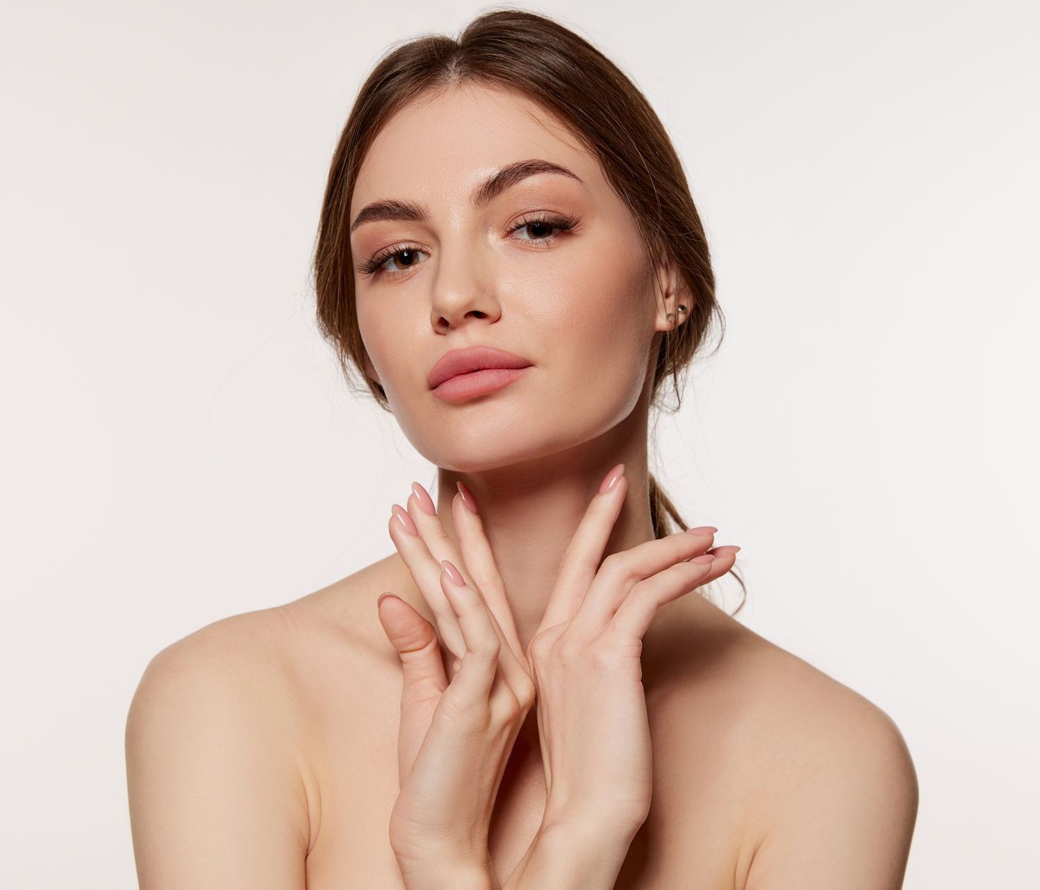 Face of woman with her beautiful hands