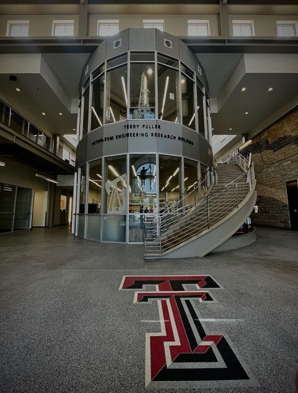 A building with stairs and a t on the floor