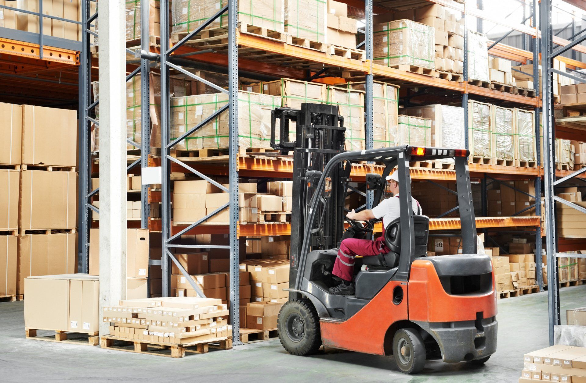 Forklift being operated as someone observes
