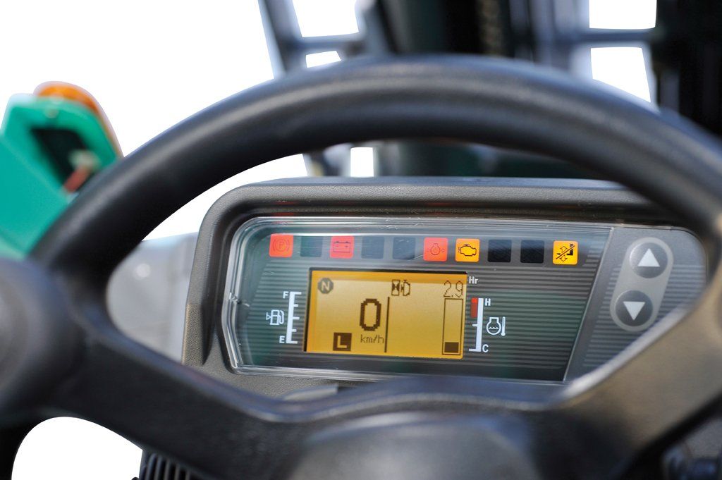 A close up of a steering wheel with a digital display that says 0
