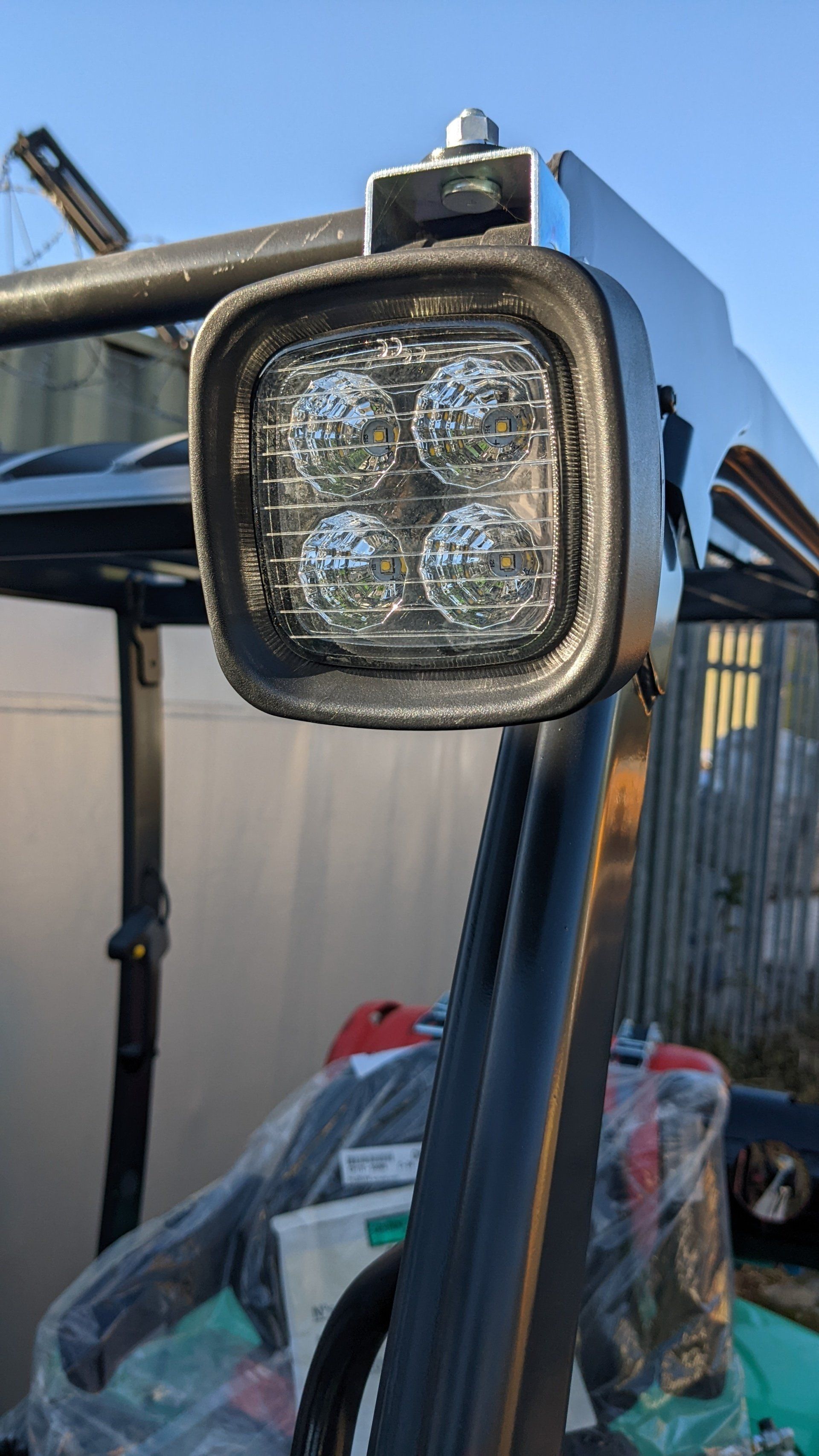 A close up of a forklift headlight on a forklift.