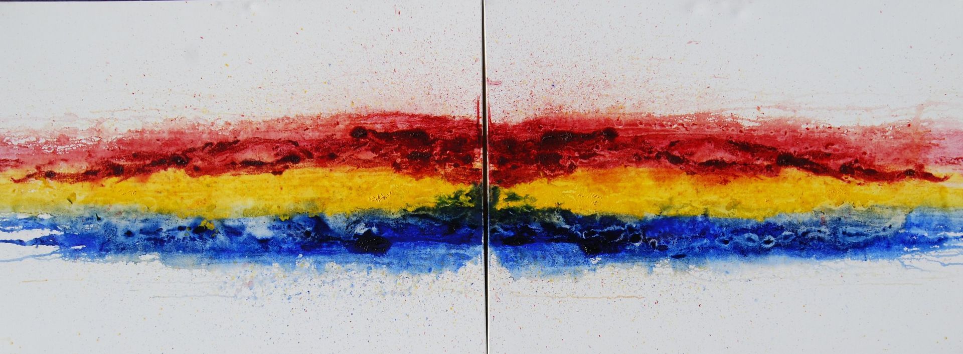 A painting of a rainbow of colors on a white surface.
