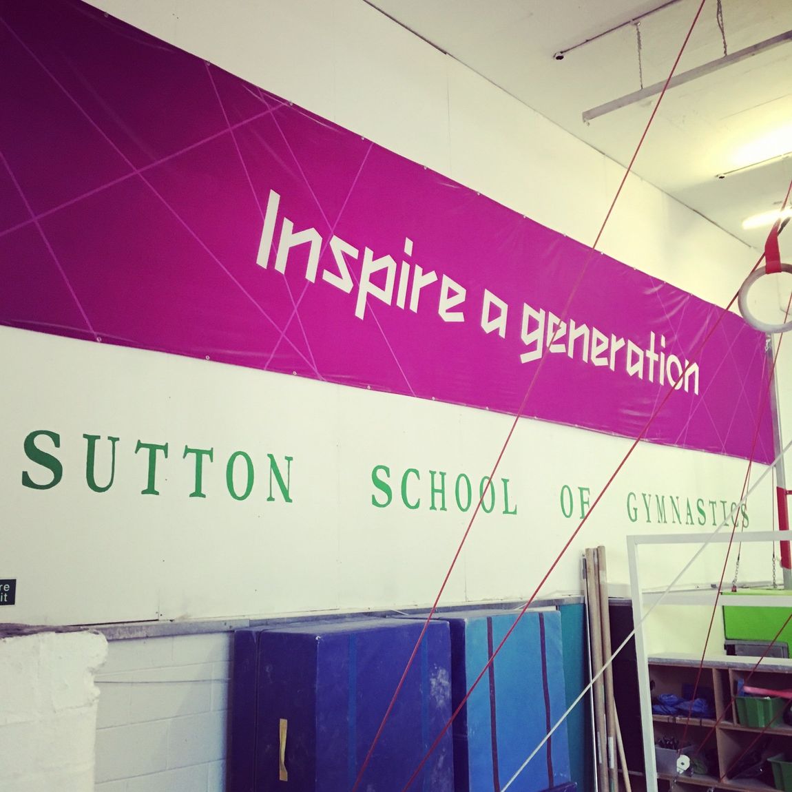 Sutton School of Gymnastics name with the London 2012 Olympic banner