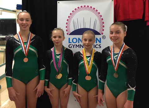 Gymnasts with medals after their competition