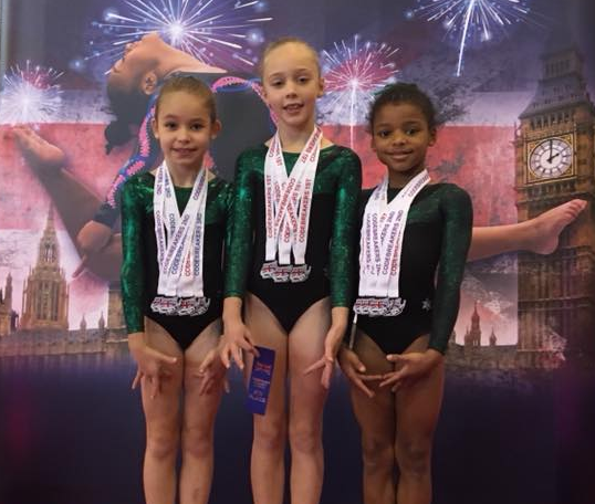 Gymnasts at the Codebreakers competition winning medals